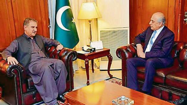 Pak foreign minister Shah Mehmood Qureshi (left) meets US envoy Zalmay Khalilzad in Islamabad on Friday(Pak Foreign Office via AP)