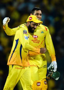 Chennai Super Kings cricketer with Ravindra Jadeja (L) embraces captain Mahendra Singh Dhoni (R) after winning against Kings XI Punjab. (AFP) 