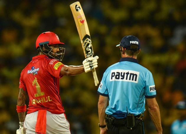 Kings XI Punjab cricketer K. L. Rahul raises his bat to celebrate after scoring a fifty during the 2019 Indian Premier League (IPL) Twenty20 cricket match between Chennai Super Kings and Kings XI Punjab. (AFP) 