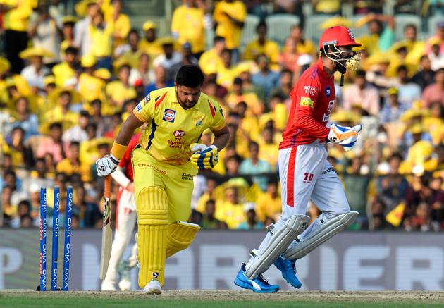 Kings XI Punjab cricketer K. L. Rahul (R) celebrates a wicket of Chennai Super Kings Suresh Raina (L) during the 2019 Indian Premier League (IPL) match between Chennai Super Kings and Kings XI Punjab at the M.A. Chidambaram Stadium in Chennai. (AFP) 
