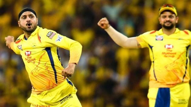 Chennai Super Kings cricketer Harhbajan Singh (L) along with Suresh Raina (R) celebrate a wicket of Kings XI Punjab's Mayank Agarwal (AFP)