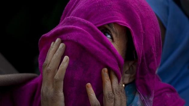 A Kashmiri Muslim woman with her face covered prays as the head priest displays a relic at the Hazratbal shrine on the occasion of Mehraj-u-Alam, believed to mark the ascension of Prophet Muhammad to heaven, in Srinagar, Jammu and Kashmir. (Dar Yasin / AP) A Kashmiri Muslim woman with her face covered prays as the head priest displays a relic at the Hazratbal shrine on the occasion of Mehraj-u-Alam, believed to mark the ascension of Prophet Muhammad to heaven, in Srinagar, Jammu and Kashmir. (Dar Yasin / AP)