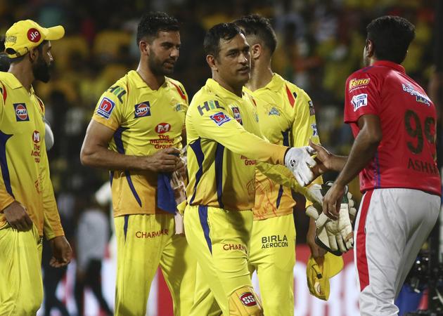 Chennai Super Kings captain Mahendra Singh Dhoni, second right, shakes hands with Kings XI Punjab captain Ravichandran Ashwin, right, after their win in Chennai. (AP) 