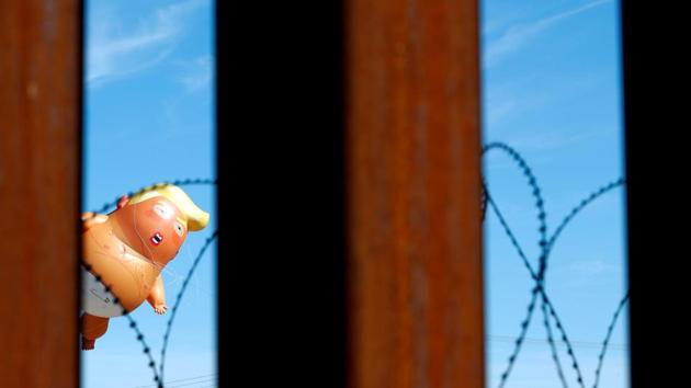 A “Baby Trump” balloon floating during a protest against US President Donald Trump visit to Calexico, California, as seen from Mexicali, Mexico (Carlos Jasso / REUTERS) A “Baby Trump” balloon floating during a protest against US President Donald Trump visit to Calexico, California, as seen from Mexicali, Mexico (Carlos Jasso / REUTERS)