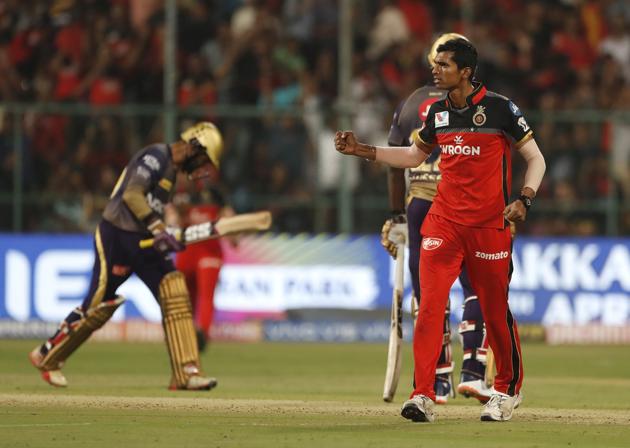 Navdeep Saini, right, celebrates the dismissal of Kolkata Knight Riders captain Dinesh Karthik. (AP) Navdeep Saini, right, celebrates the dismissal of Kolkata Knight Riders captain Dinesh Karthik. (AP)