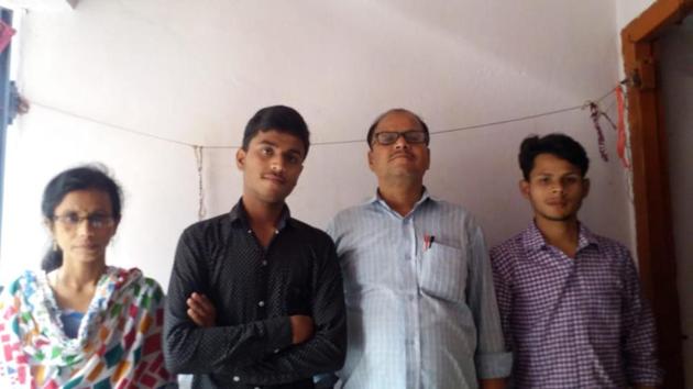 Ronit Raj, second topper with his family (HT) Ronit Raj, second topper with his family (HT)