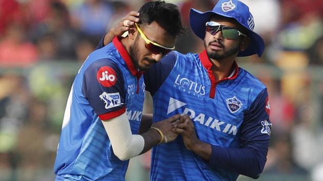 Delhi Capitals' Axar Patel, left, celebrates with captain Shreyas Iyer the dismissal of Royal Challengers Bangalore's Marcus Stoinis.(AP) Delhi Capitals' Axar Patel, left, celebrates with captain Shreyas Iyer the dismissal of Royal Challengers Bangalore's Marcus Stoinis.(AP)