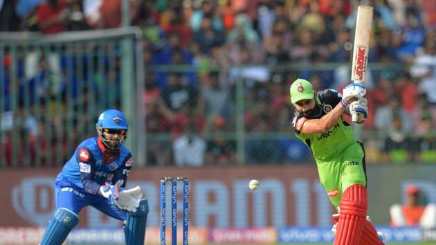 Royal Challengers Bangalore batsman and captain Virat Kohli (R) plays a shot. (AFP)