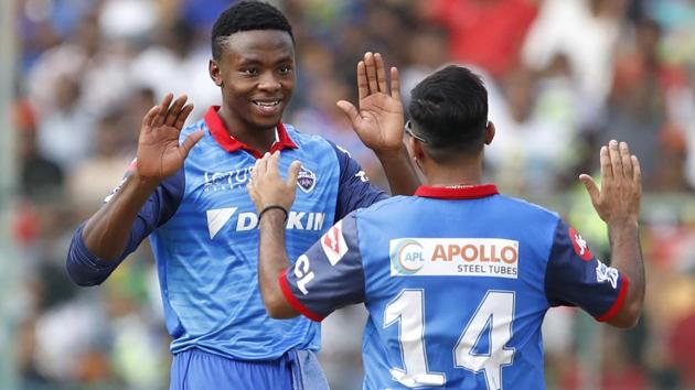 Delhi Capitals' Kagiso Rabada, left, celebrates the dismissal of Royal Challengers Bangalore's Akshdeep Nath. (AP)