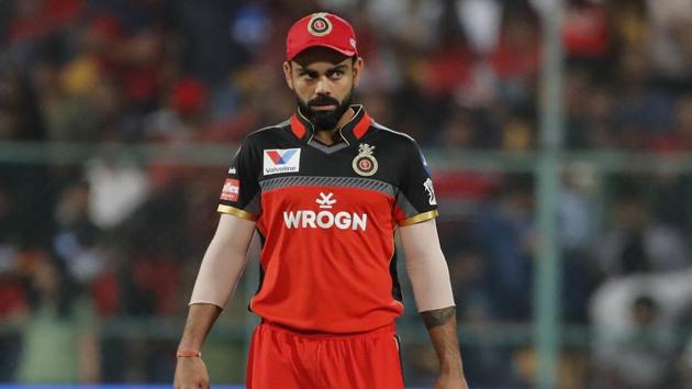 Royal Challengers Bangalore captain Virat Kohli walks into the field at the start of the VIVO IPL T20 cricket match between Royal Challengers Bangalore and Mumbai Indians in Bangalore(AP)