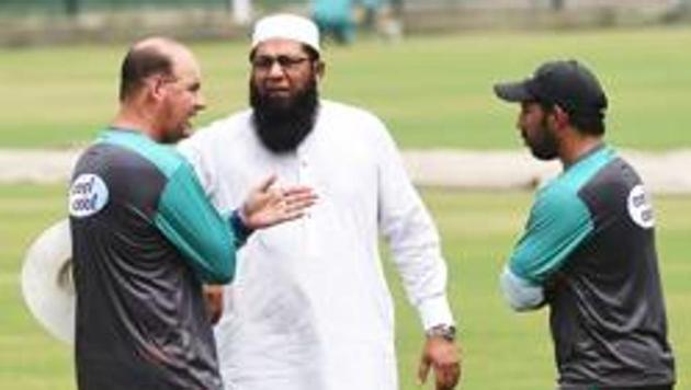 Pakistan cricket chief selector Inzamam-ul-Haq (C) talks with team coach Mickey Arthur (L) and captain Sarfraz Ahmed during the team practise at the Gaddafi stadium in Lahore on September 4, 2018. (AFP) Pakistan cricket chief selector Inzamam-ul-Haq (C) talks with team coach Mickey Arthur (L) and captain Sarfraz Ahmed during the team practise at the Gaddafi stadium in Lahore on September 4, 2018. (AFP)