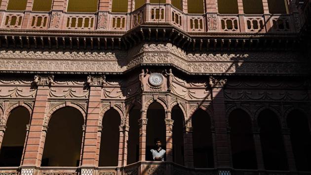 A man looks out from a balcony at the Bhanwar Niwas. Singh warned that if action is not taken now to preserve and protect the houses, there will be nothing for future generations to see. He warned: “If things don’t change quickly, we may not have any of these havelis in two decades.” (Chandan Khanna / AFP)