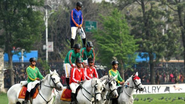 Nepali mounted soldiers bring out a human pyramid on horseback as they take part in the Ghode Jatra festival in Kathmandu. (Prakash Mathema / AFP) Nepali mounted soldiers bring out a human pyramid on horseback as they take part in the Ghode Jatra festival in Kathmandu. (Prakash Mathema / AFP)