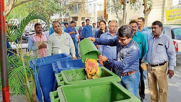 At a function, SDMC officials gave away brown paper bags of compost to local residents(HTPhoto)