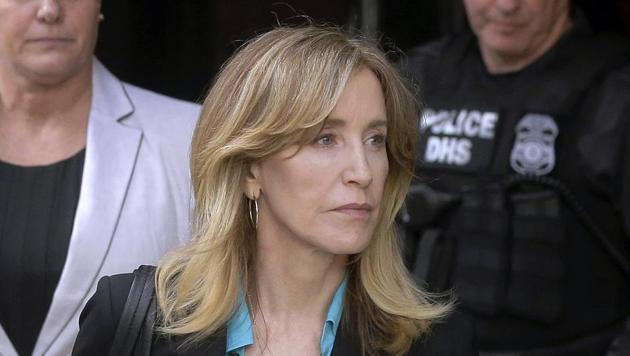 Felicity Huffman arrives at federal court in Boston to face charges in a nationwide college admissions bribery scandal (AP) Felicity Huffman arrives at federal court in Boston to face charges in a nationwide college admissions bribery scandal (AP)