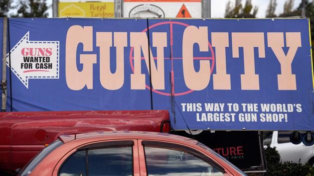 (FILES) A photo taken on March 21, 2019 shows signs pointing towards a gun shop in Christchurch claiming to be the world's largest gun shop, six days after the twin mosque shooting massacre that claimed the lives of fifty people. (AFP file photo for representation.) (FILES) A photo taken on March 21, 2019 shows signs pointing towards a gun shop in Christchurch claiming to be the world's largest gun shop, six days after the twin mosque shooting massacre that claimed the lives of fifty people. (AFP file photo for representation.)