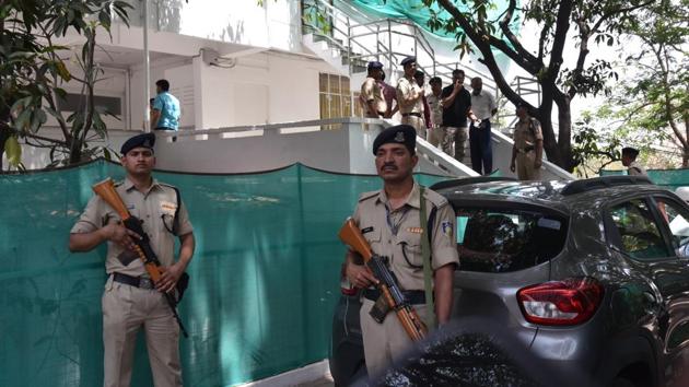 Police personnel stand guard during an Income Tax raid at the residence of Praveen Kakkar, Officer on Special Duty (OSD) to Madhya Pradesh CM Kamal Nath, in Bhopal. Nath on Tuesday alleged that the Income Tax department raids against several of his aides were politically motivated. Those raided were CM’s nephew Ratul Puri, Praveen Kakkar and a close associate RK Miglani. (Mujeeb Faruqui / HT File)