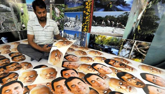 A vendor sells masks of political leaders ahead of Lok Sabha elections 2019.(HT file photo)
