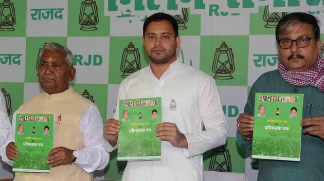 RJD leader Tejashwi Yadav releases his party’s election manifesto in Patna on Monday. (Santosh Kumar/HT Photo) RJD leader Tejashwi Yadav releases his party’s election manifesto in Patna on Monday. (Santosh Kumar/HT Photo)
