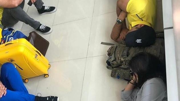 Photograph of MS Dhoni and his wife Sakshi Dhoni sleeping at the airport.(Instagram/MS Dhoni)