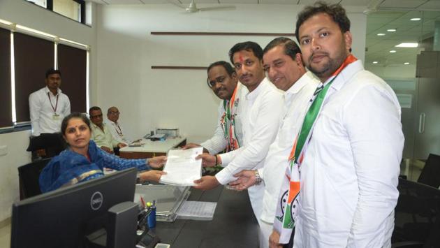 Parth Pawar (NCP, third from right) and Shrirang Barne (Shiv Sena, fourth from right)), both filed nomination papers to contest Lok Sabha elections 2019 from Maval, on Tuesday. (HT PHOTO) 