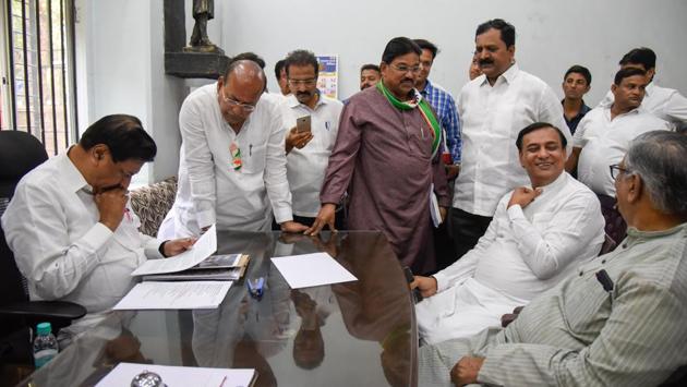 (Left) Prithviraj Chavan, Mohan Joshi (second from left) and Sunil Shinde (fifth from left) at the Congress Bhavan on Monday. (SANKET WANKHADE/HT PHOTO) 