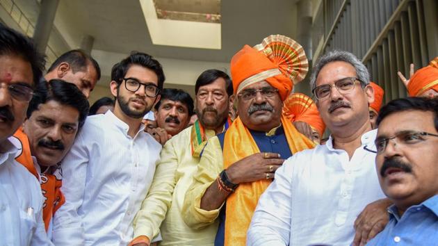 (Third from left) Aditya Thackeray (Shiv Sena party youth chief ) along with Girish Bapat (fourth from left), BJP leader arrives at an rally of Shivajirao Adhalrao (third from right) in front of collector office before he goes to fill his application for election in Shirur constituency on Tuesday. (SANKET WANKHADE/HT PHOTO) 