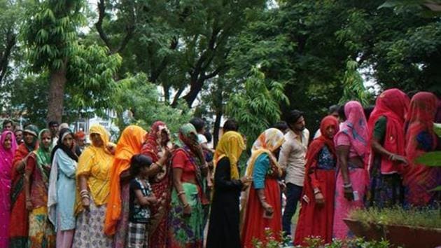 Rajasthan, India – August 17, 2015: Women voters wait to cast their votes during Municipal Corporation polls at a polling booth of Chomu, in Jaipur, Rajasthan, India on Monday, August 17, 2015.(Prabhakar Sharma/ Hindustan Times) Rajasthan, India – August 17, 2015: Women voters wait to cast their votes during Municipal Corporation polls at a polling booth of Chomu, in Jaipur, Rajasthan, India on Monday, August 17, 2015.(Prabhakar Sharma/ Hindustan Times)