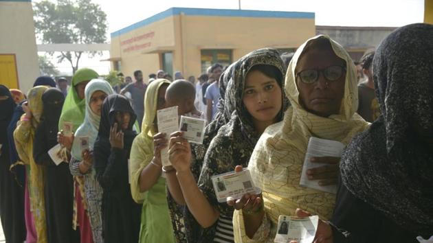 People lined up at polling centre in Dasna, Ghaziabad. The elections will see a raft of new measures, such as Voter Verified Paper Audit Trails in all voting machines (which corresponded to 1.74 million VVPAT units) to end any doubts about the veracity of vote cast, photographs of the candidates in EVMs in an apparent attempt to end confusion between nominees with similar names. (Sakib Ali / HT Photo) People lined up at polling centre in Dasna, Ghaziabad. The elections will see a raft of new measures, such as Voter Verified Paper Audit Trails in all voting machines (which corresponded to 1.74 million VVPAT units) to end any doubts about the veracity of vote cast, photographs of the candidates in EVMs in an apparent attempt to end confusion between nominees with similar names. (Sakib Ali / HT Photo)