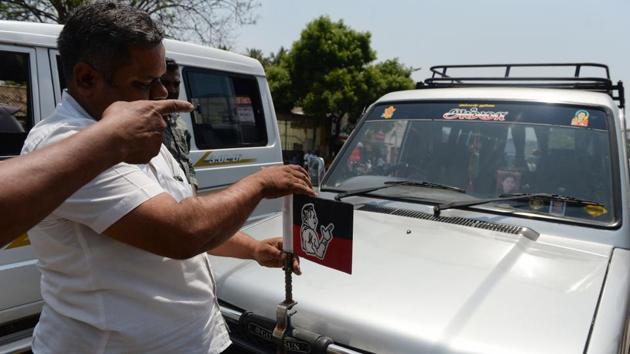 A member of a flying squad removes an AIADMK party flag from a car during a patrol. “Many politicians say that voters themselves demand freebies and they feel even more pressured if any rival offers them,” said Verma. “It is a temptation many can’t resist. One can still understand the economically weak doing it but in some Indian states including Tamil Nadu, even the middle classes often take the money and the freebies,” he added. (Arun Sankar / AFP) A member of a flying squad removes an AIADMK party flag from a car during a patrol. “Many politicians say that voters themselves demand freebies and they feel even more pressured if any rival offers them,” said Verma. “It is a temptation many can’t resist. One can still understand the economically weak doing it but in some Indian states including Tamil Nadu, even the middle classes often take the money and the freebies,” he added. (Arun Sankar / AFP)