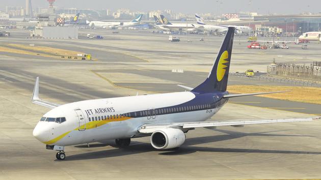 A Jet Airways aircraft at the Mumbai International Airport. Down to 14 operational aircraft, Jet Airways may be barred from operating on international routes.(Abhijit Bhatlekar/Mint)
