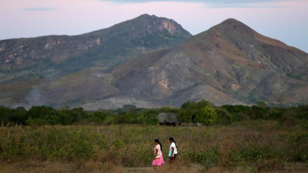 Macuxi women walk at the community of Maturuca on the Raposa Serra do Sol reservation. Bolsonaro’s first move after his January inauguration was to put indigenous land decisions under the Ministry of Agriculture, which is controlled by farm sector representatives eager to open up new frontiers to large-scale farming. The president has already singled out Raposa Serra do Sol. (Bruno Kelly / REUTERS)