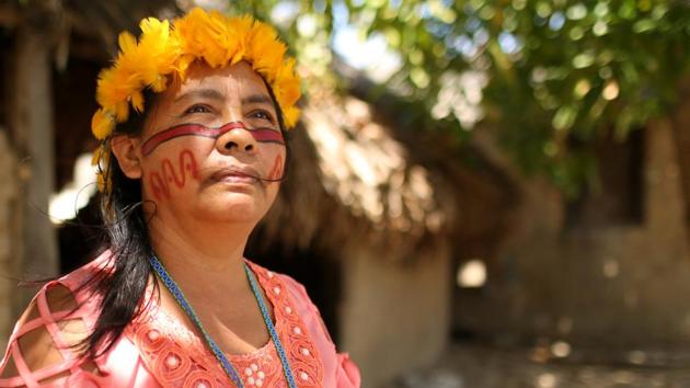 “I want to ask the new president Jair Bolsonaro to respect indigenous people and our constitutional rights,” said community leader Tereza Pereira de Souza, her hair crowned with a headdress of yellow feathers. “It took us 30 years to get our land borders legally recognized and registered,” she said. (Bruno Kelly / REUTERS)