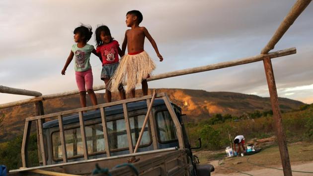 Indigenous Macuxi children play at the community of Maturuca on the Raposa Serra do Sol reservation, Roraima state, Brazil. A decade after the Macuxi people won a bloody legal battle to expel rice planters from their reservation in a remote part of Brazil, their hold over ancestral lands has come under threat again from new right-wing President Jair Bolsonaro. (Bruno Kelly / REUTERS)