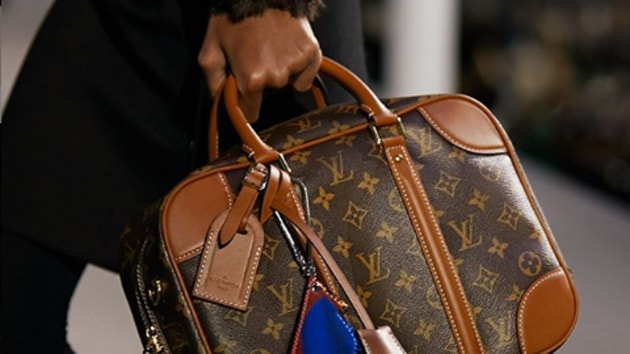 With 'pop-ups' and menswear, Vuitton aims to keep luxury crown