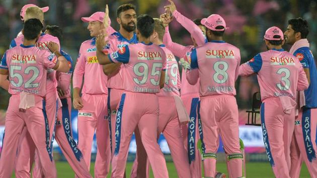 Rajasthan Royals team players celebrate the dismissal of Chennai Super Kings cricketer Shane Watson.(AFP)