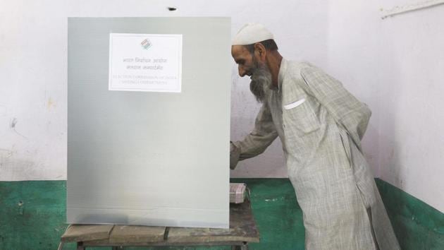 A man casts his vote at Loyi village, in Muzaffarnagar district, Uttar Pradesh. A total of nearly 900 million people are eligible to exercise their franchise in the seven-phase general election this time around. (Vipin Kumar / HT Photo)