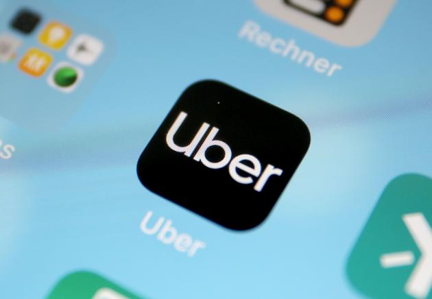 A picture showing global ride-hailing giant, Uber application, on a smart phone(AFP File)