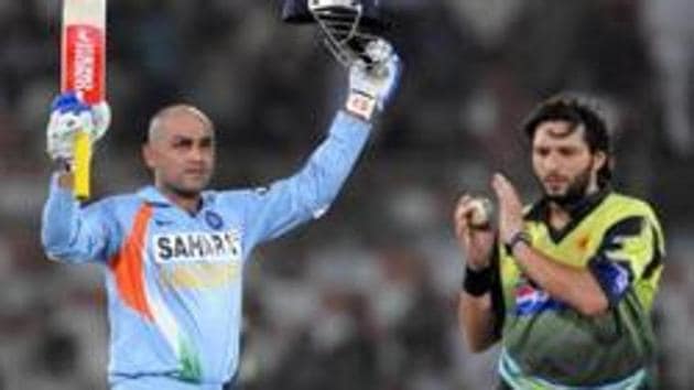 A file photo of Virender Sehwag (L) and Shahid Afridi. (AFP/Getty Images) A file photo of Virender Sehwag (L) and Shahid Afridi. (AFP/Getty Images)