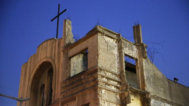 Bullet holes from Lebanon’s 1975-1990 civil war are seen on the walls of the St. Vincent de Paul church in downtown Beirut. “For a foreigner, it is a destroyed building. For us, it is a painful reminder of the bullets that pierced our bodies, streets and walls,” Mandour said. “I don’t want these buildings to disappear, their mission is not over yet.” (Hassan Ammar / AP)