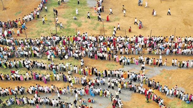 Mumbai, India - October 13, 2009: People queue to cast their votes outside a polling center during the Maharashtra state elections in Chandivali, Mumbai, on October 13, 2009. (Photo by Manoj Patil / HT Archive)