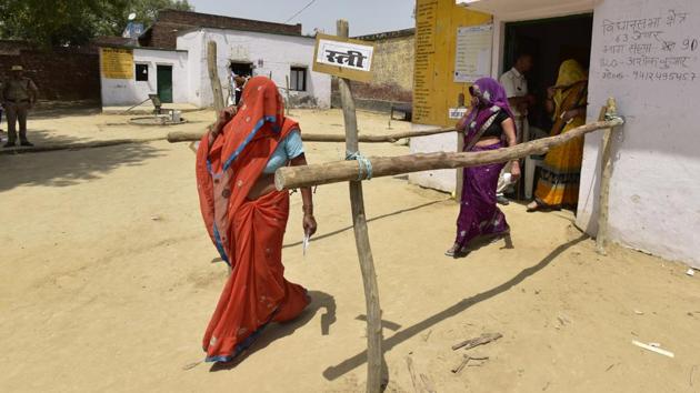 Women exit a polling centre after casting their vote, at Bhatta Parsaul, in Uttar Pradesh. The voter turnout where 142 million people were eligible to exercise their franchise, averaged 66%, according to a Hindustan Times calculation of individual breakups provided by the Election Commission of India. (Virendra Singh Gosain / HT Photo)