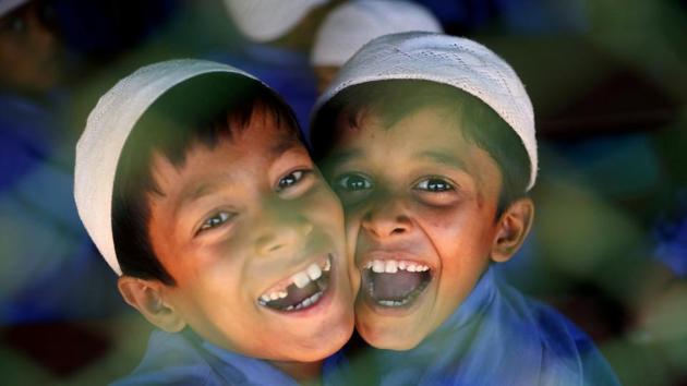 Rohingya refugee boys who study in an Islamic school smile as they react to the camera at a refugee camp in Cox’s Bazar, Bangladesh. (Mohammad Ponir Hossain / REUTERS) 