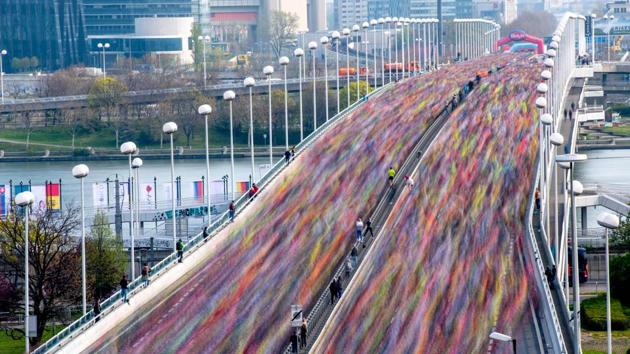 Competitors run on the Reichsbrucke bridge after taking the start of the 36th edition of Vienna Marathon in Vienna, Austria. (Joe Klamar / AFP) 