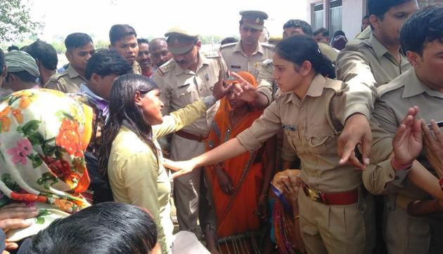 Angry villagers in Mainpuri arguing with police after a young woman and her mother shot dead by a man whose marriage proposal they rejected. (HT PHOTO) Angry villagers in Mainpuri arguing with police after a young woman and her mother shot dead by a man whose marriage proposal they rejected. (HT PHOTO)