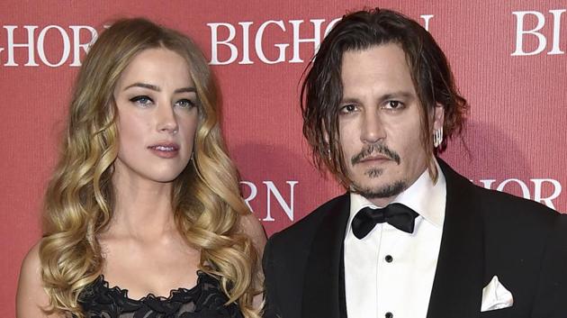 Amber Heard, left, and Johnny Depp arrive at the 27th annual Palm Springs International Film Festival Awards.(Jordan Strauss/Invision/AP) Amber Heard, left, and Johnny Depp arrive at the 27th annual Palm Springs International Film Festival Awards.(Jordan Strauss/Invision/AP)