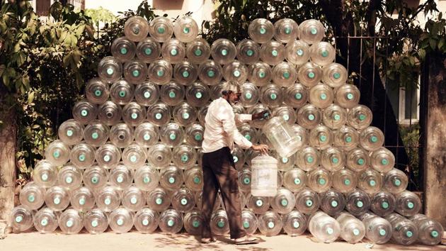 Empty water jars are seen piled up in a pyramid by vendor at Juhu in Mumbai, Maharashtra. (Pramod Thakur / HT Photo) Empty water jars are seen piled up in a pyramid by vendor at Juhu in Mumbai, Maharashtra. (Pramod Thakur / HT Photo)