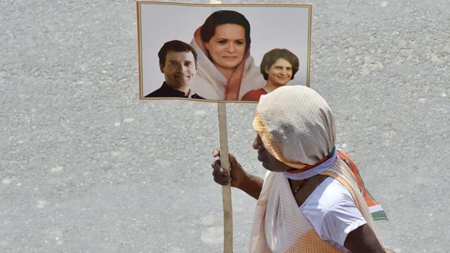 A Congress supporter holds a placard as she waits for a view of Congress President Rahul Gandhi before filling his nomination for Lok Sabha election in Amethi, Uttar Pradesh. (Ajay Aggarwal / HT Photo) A Congress supporter holds a placard as she waits for a view of Congress President Rahul Gandhi before filling his nomination for Lok Sabha election in Amethi, Uttar Pradesh. (Ajay Aggarwal / HT Photo)