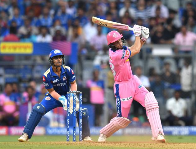 Rajasthan Royals batsman Jos Buttler (R) plays a shot during the 2019 Indian Premier League (IPL) Twenty20 cricket match between Mumbai Indians and Rajasthan Royals at the Wankhede Stadium in Mumbai . (AFP)