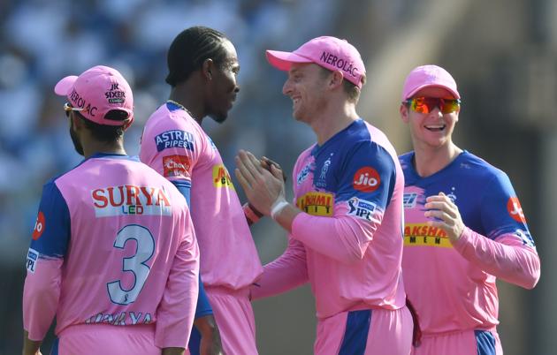 Rajasthan Royals bowler Jofra Archer (2L) celebrates with teammates Jos Buttler, captain Ajinkya Rahane and Steven Smith (R) after taking the wicket of Mumbai Indians captain Rohit Sharma during the 2019 Indian Premier League (IPL) Twenty20 cricket match between Mumbai Indians and Rajasthan Royals at the Wankhede Stadium in Mumbai. (AFP)